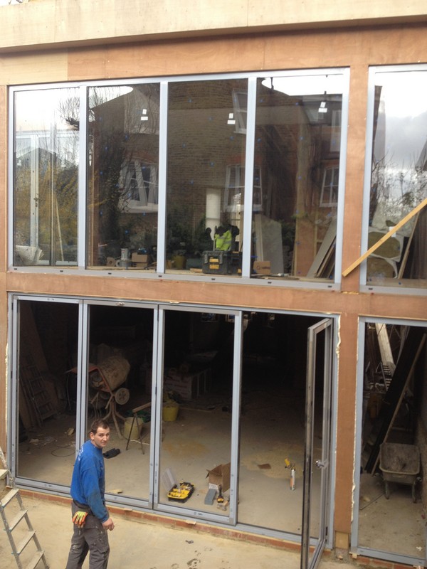 Aluminium bi-fold doors with two-storey glazing in Aylesbury