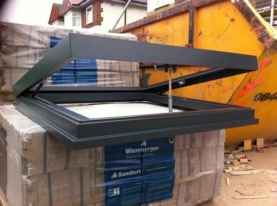 Opening flat roof skylight in anthracite grey installed in Aylesbury